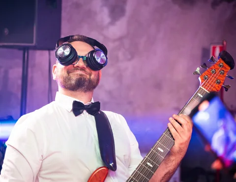 The Gloves bassist wearing oversized novelty glasses