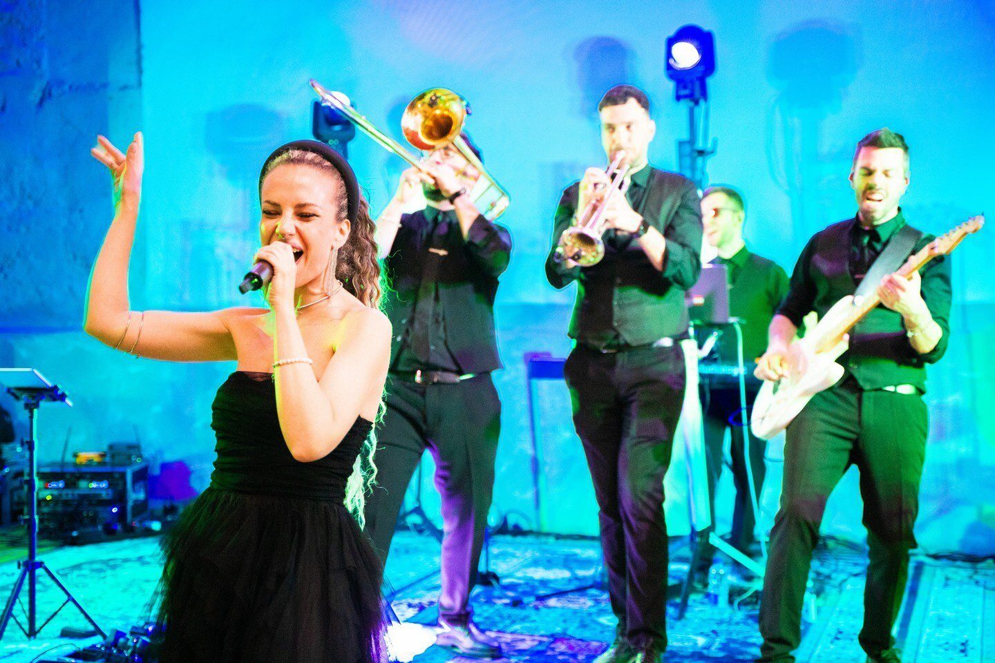 Italian live wedding band performing on stage with singer and musicians